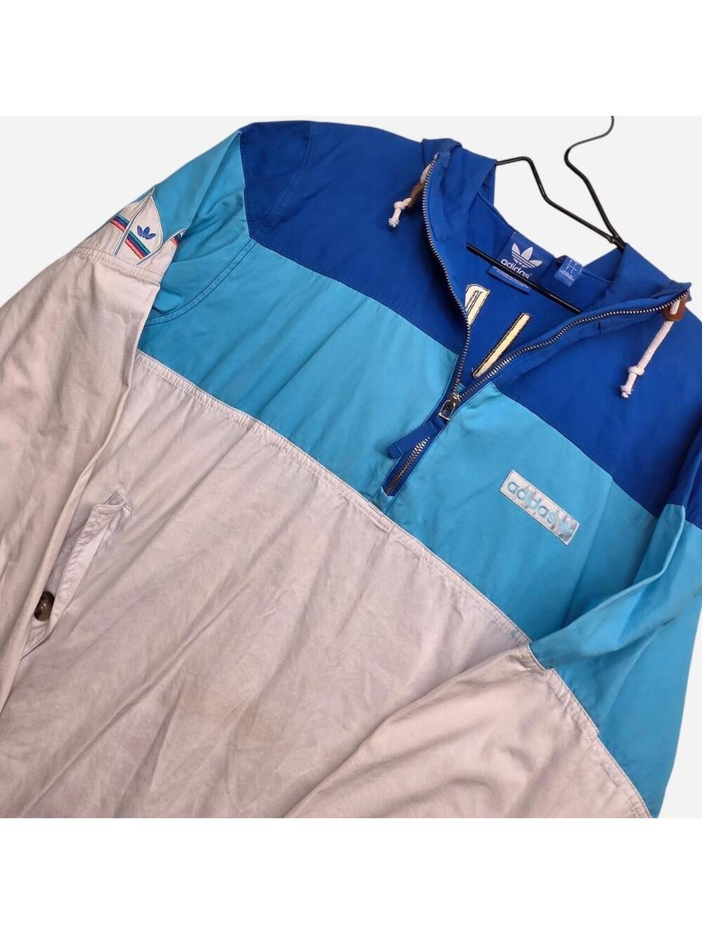 Adidas windbreaker jacket with blue, light blue, and white color blocking. Y2K